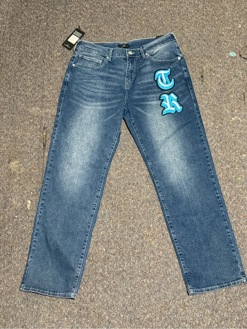 True Religion Men's Blue Jeans with Turquoise Script Patch